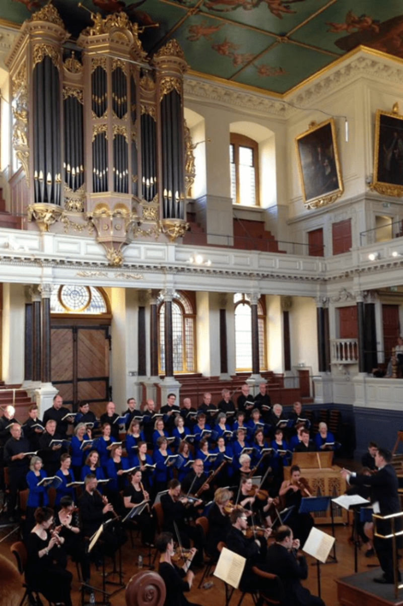 image of the Oxford Pro Musica Choir performing at the Sheldonian Theatre 