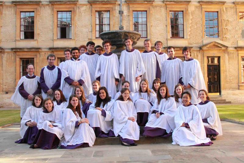 Choir of Queen's College Oxford in white gowns